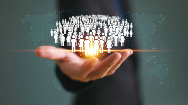 istock Population rate factor decline crisis concept. Increase birth rate infographic, fertility rate decrease control. Businessman hold population family icon with world map background. Demography statistic 2173915106