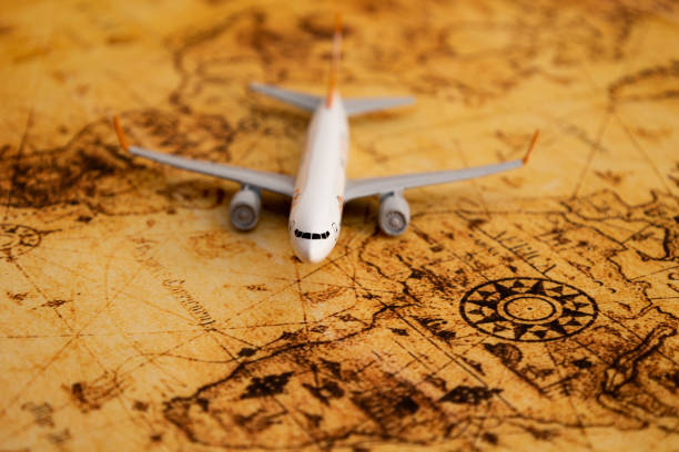 istock Front view of miniature airplane on an old map 2173915804