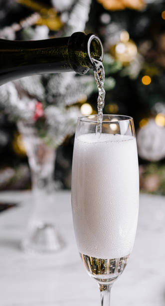 istock Pouring sparkling wine into flute glass 2173915984