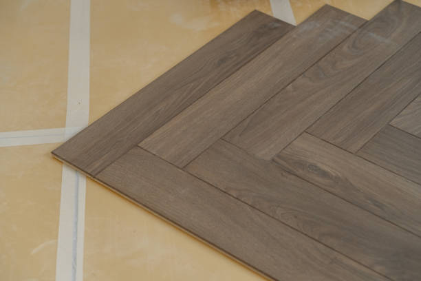 istock Laminate flooring installation in progress. Step-by-step laying of planks 2173922702