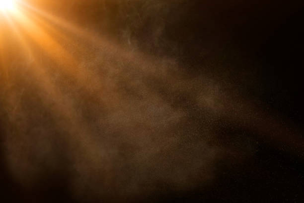 istock orange spotlight on stage or gods rays isolated on black background 2173923323
