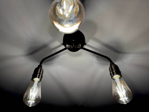 istock Ceiling lights casting shadows across the ceiling in a domestic setting 2173926829