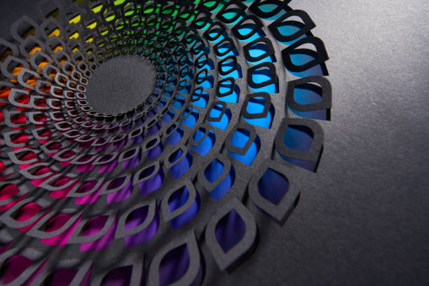 istock Intricate paper cut artwork with layered circular pattern revealing a vibrant gradient of rainbow colors 2173927752