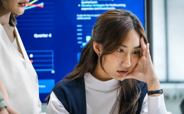 istock team of finance  get stress when analyzing economic crisis data and recession impacts during meeting in a office 2173928241