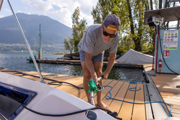 istock Man Skillfully Docking a Boat at the Tranquil Lakeside Fuel Station for Refueling 2173936664