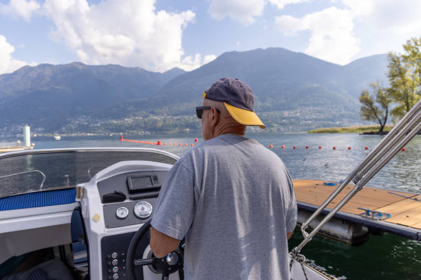 istock Man Steering a Boat on a Sunny Day 2173936932
