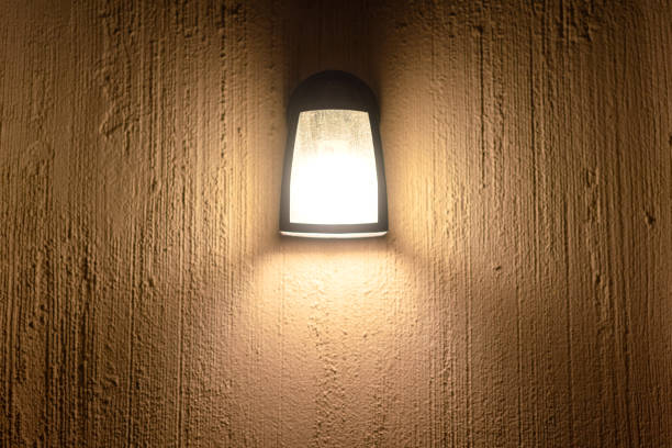 istock A square shape lighting lamp on cement wall. Interior decoration. 2173939605