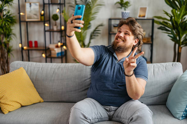 istock Young Man Taking Selfies At Home 2173941436