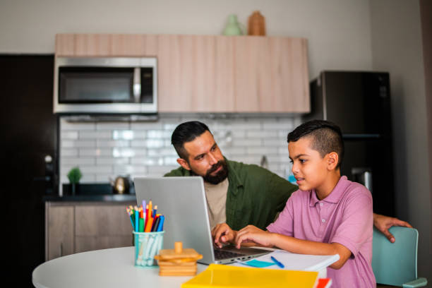 istock Child boy studying and talking to father at home 2173950038