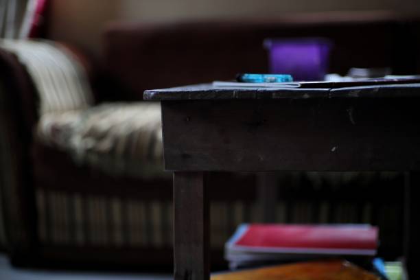 istock A wooden coffee table is shown in the foreground. 2173951917