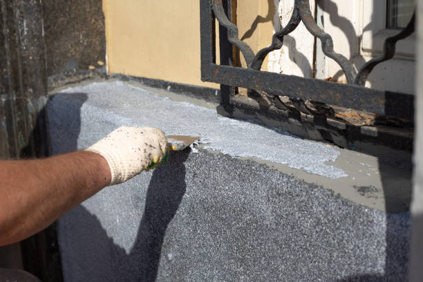 istock Blue collar hard work with spatula on building wall 2173954393