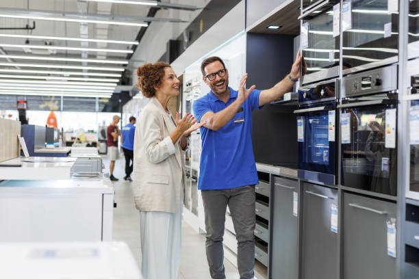 istock Friendly salesperson assisting customer in appliance store 2173956880