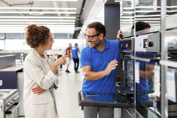 istock Friendly discussion between a customer and employee in appliance store 2173956936