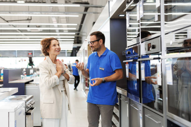 istock Customer consulting sales associate in appliance store 2173956952