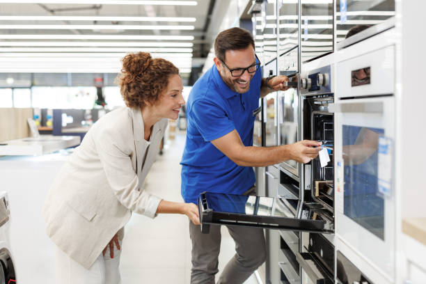 istock Customer receiving assistance in home appliance store 2173956984