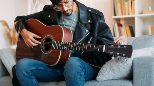 istock Guitar playing creative hobby musician instrument 2173958723