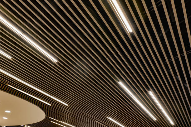 the ceiling is lit up with a series of lights stock photo