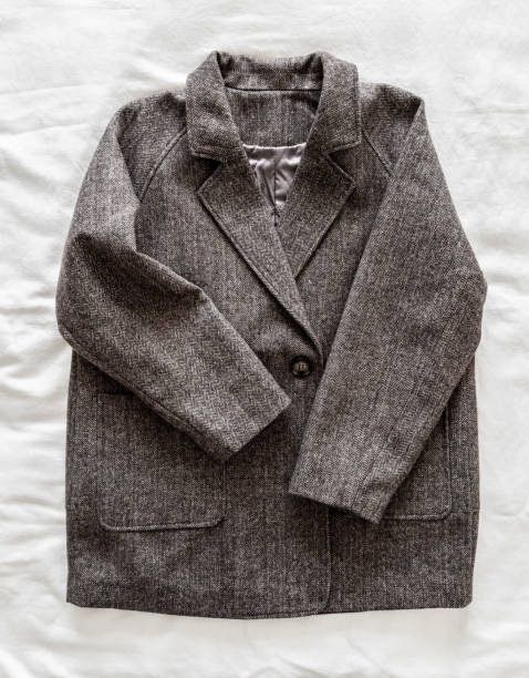 istock Woolen half-coat in english style on a light background, top view 2173960435
