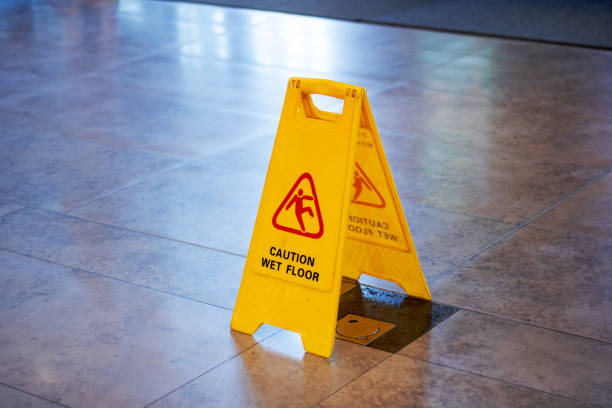 istock A caution sign warning of wet floor in yellow displayed on tiled surface 2173961149