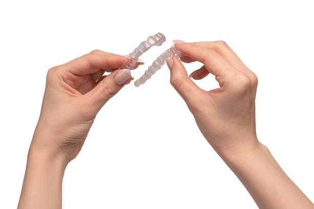 istock Transparent mouth guard in a woman's hand isolated on white background. 2173961713