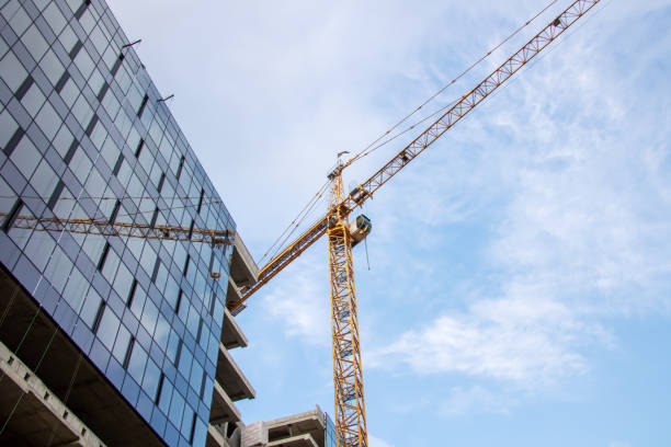 istock During the day, a crane is seen in front of a building under construction 2173964098