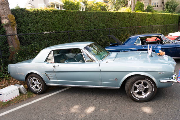 Seattle, WA, USA -July 3, 2024: Mint Red Ford Mustang 1965 1966. American classic retro car