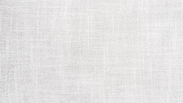 istock White hessian sackcloth woven with jute burlap cotton fabric cloth textile texture pattern background in white light color 2173964529