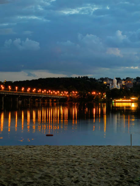 istock Light in the Water: Night Lights and Riverbank Temple 2173966881