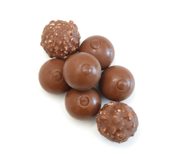 istock Chocolate candies isolated on white background 2173967893
