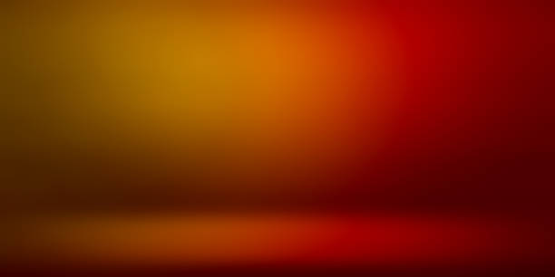 istock studio room background in gradient red, yellow neon light use as background. 2173969725