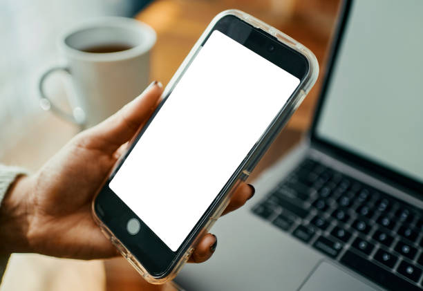 istock Close-Up of Woman's Hand with Mobile Phone, Displaying a White Screen 2173972350