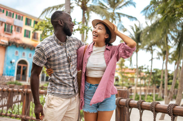 istock Joyful Diverse Couple Enjoying Seaside Walk 2173972393