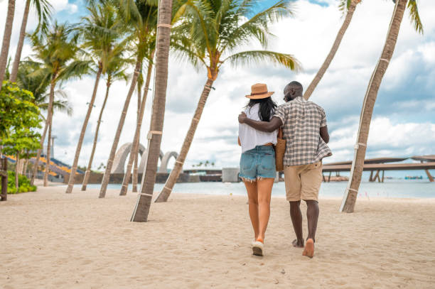 istock Diverse Couple Strolls Along Tropical Beach 2173972402
