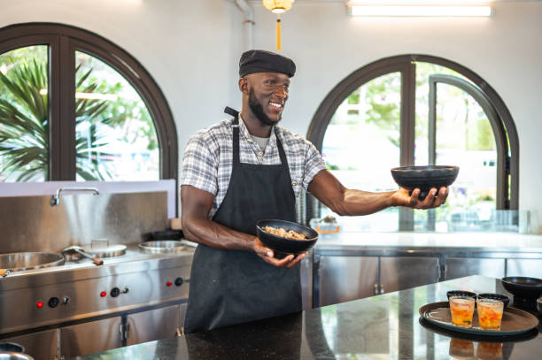 istock Enthusiastic Cook Presents Dish in Modern Asian Eatery 2173972505