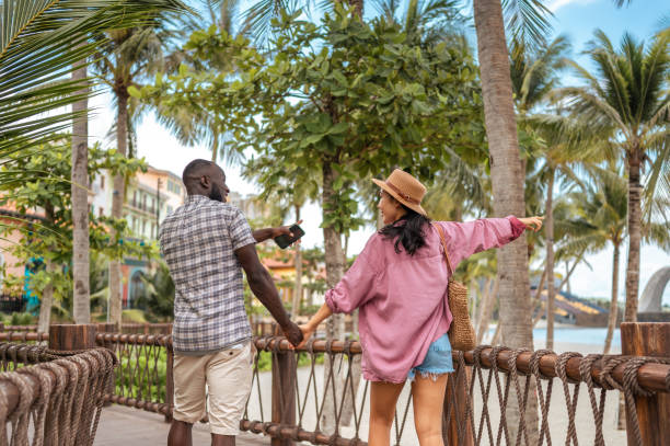 istock Interracial Couple Enjoying Seaside Promenade Stroll 2173972788
