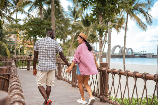istock Interracial Couple Enjoying Beachside Stroll 2173972790