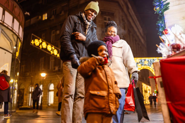 istock Family Strolling Through Festive Night Market 2173972920
