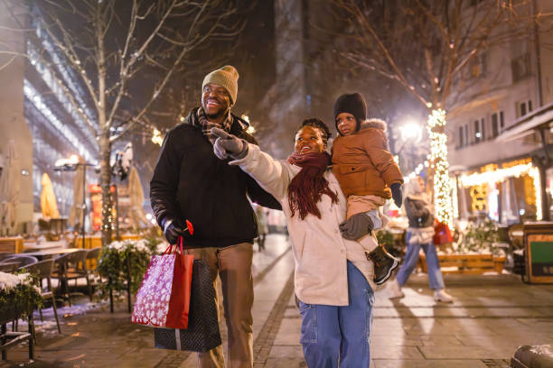 istock Family Enjoying Festive Evening Stroll 2173973030
