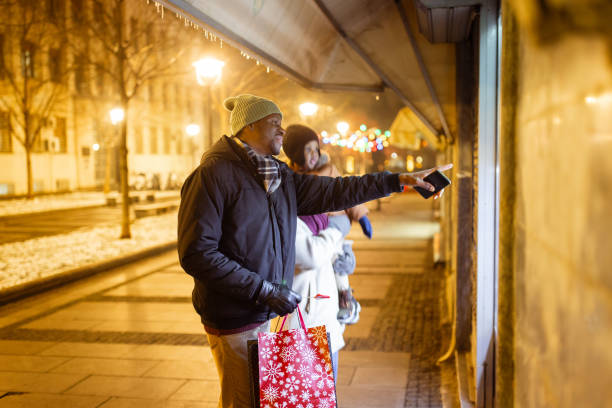 istock Couple Window Shopping on Winter Evening 2173973063