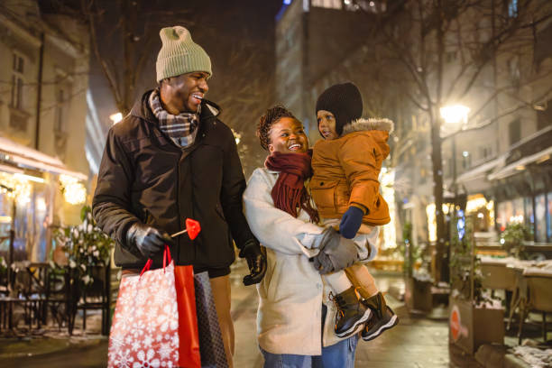 istock Family Enjoying Nighttime Winter Stroll 2173973076