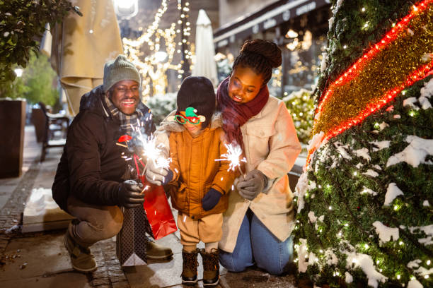 istock Holiday Joy: Family Celebrates with Sparkles at Night 2173973078