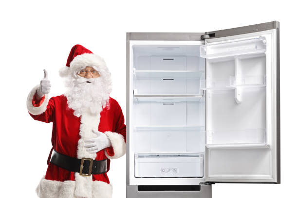 istock Santa claus leaning on an empty open fridge and showing thumbs up 2173973115