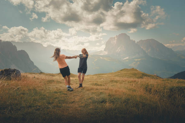 istock Friends have fun on mountain meadow 2173973441