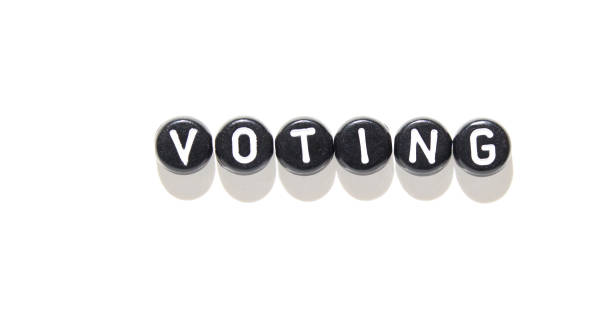 istock Black and white voting concept with word formed by letter blocks on bright 2173974455