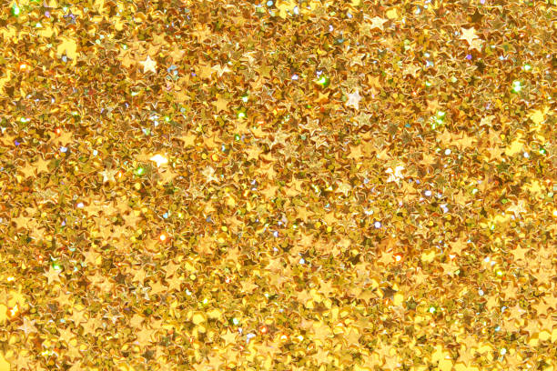istock Sparkling gold star confetti background for celebrations and festive decor 2173974488