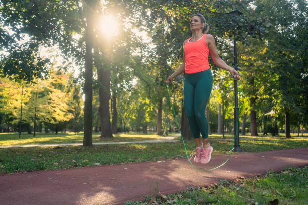 istock Athletic woman training with a jumping rope 2173974580