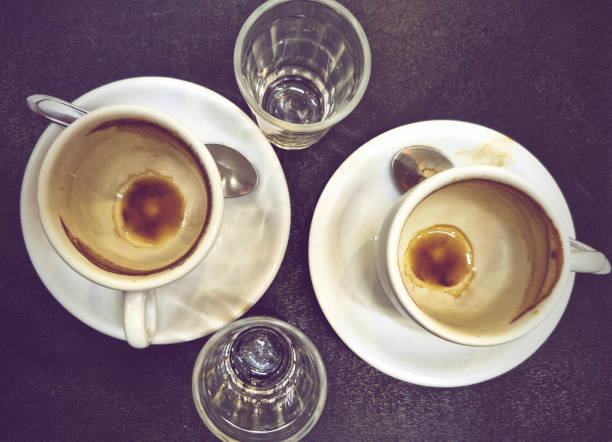 istock Two empty espresso mugs and water glasses after consumption 2173976507