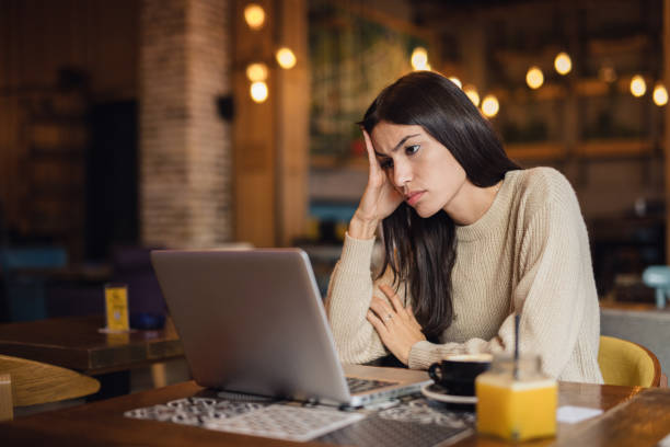 istock Worried woman looking at laptop 2173978896