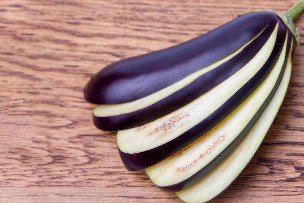 Eggplant on a wooden background. Close up. Selective focus.
