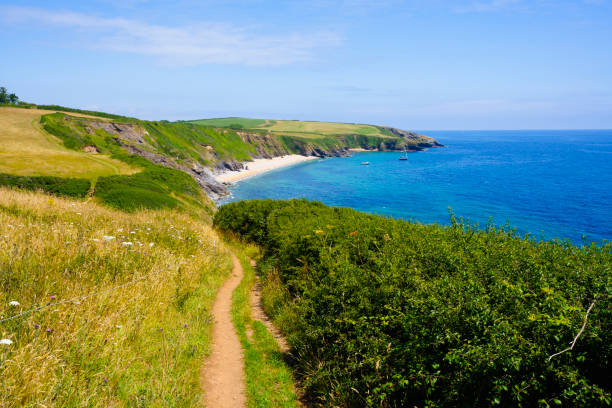 istock Following the South West Coastal Path on St. Anthony Head, Cornwall. 2173984074